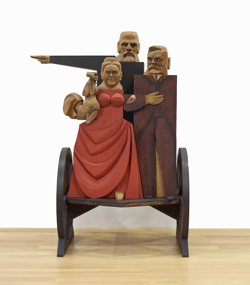 John Washington, and Emily Roebling Crossing the Brooklyn Bridge for the First Time, 1989 Wood, stain, graphite, paint, and plaster 103 ⅞ x 74 ⅞ x 48 inches (263.8 x 190.2 x 121.9 cm) Collection Buffalo AKG Art Museum Bequest of Marisol, 2016 (2021:50a-u) © Estate of Marisol / Artists Rights Society (ARS), New York