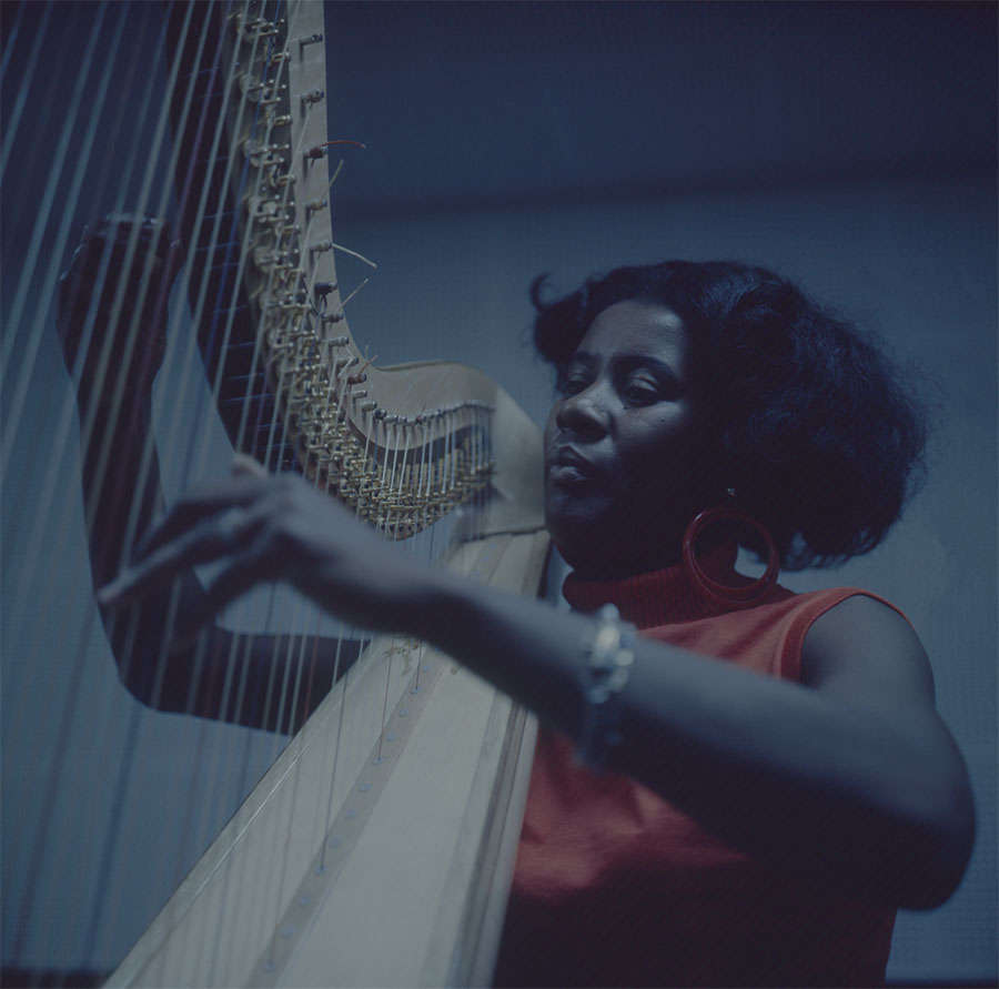 Alice Coltrane playing the harp, 1970. Photo: Chuck Stewart. © Chuck Stewart Photography, LLC / Fireball Entertainment Group